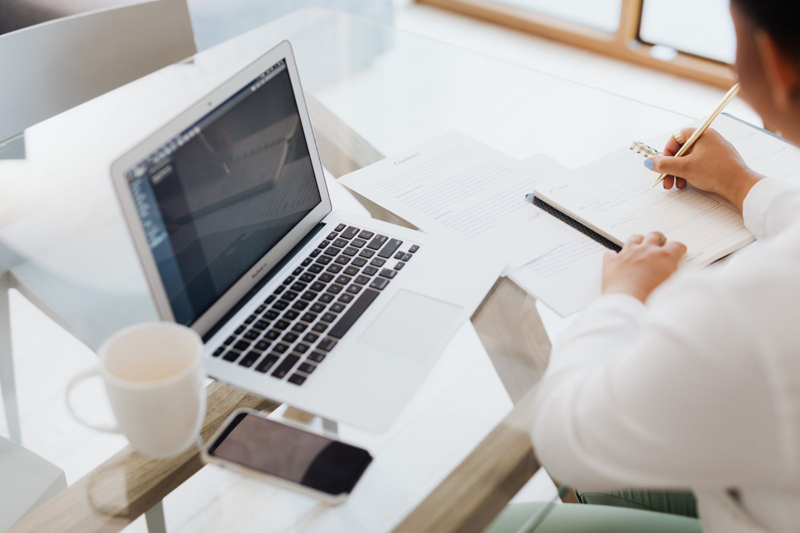 Planning a home purchase budget at a laptop