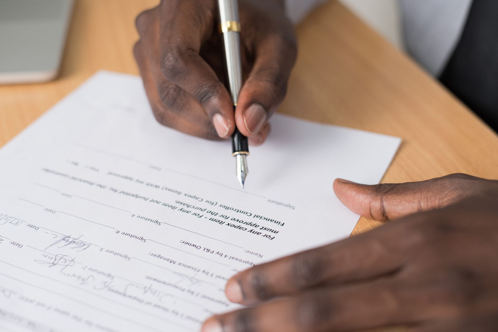 A lock agreement being signed at a closing table